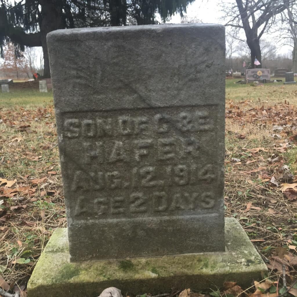 Weathered headstone reading "Son of C & E Hafer, Aug. 12, 1914, Age 2 days"